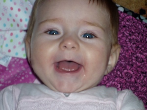 Sweet baby girl laughing during playtime